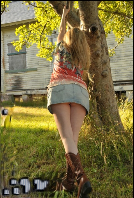 Mature amateur Tasty Trixie bares her tits and twat outside a cabin in boots