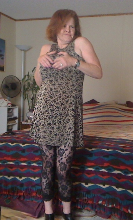 Busty granny toys her pussy after playing with nipple clamps