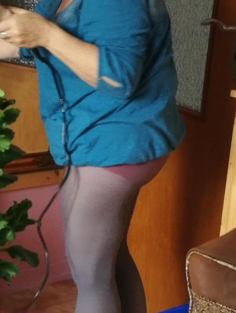 Hairy grandmother slides her upskirt panties aside to expose her vagina