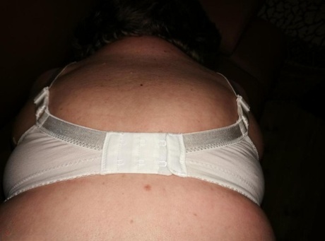 Hairy grandmother slides her upskirt panties aside to expose her vagina