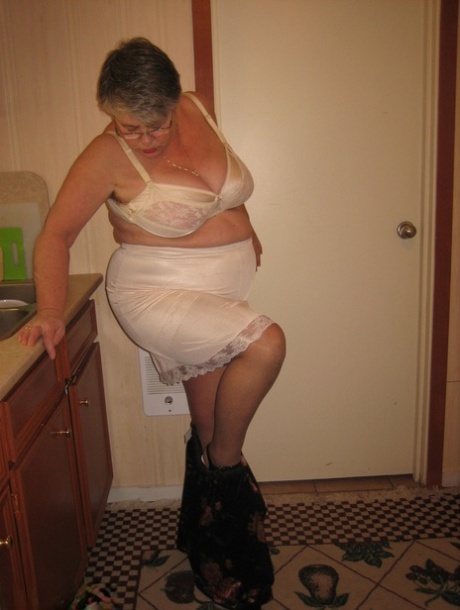 Old woman Girdle Goddess strips to pantyhose in her kitchen