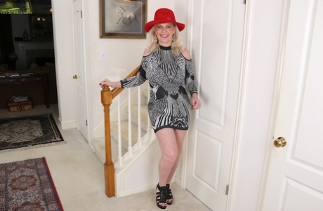 Thick granny Judy Belkins revealing big tits and ass while undressing