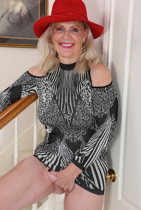 Thick granny Judy Belkins revealing big tits and ass while undressing