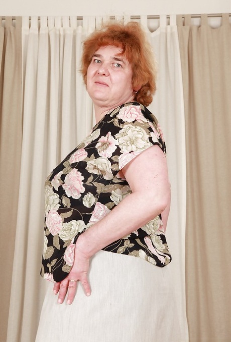 Redhead granny with massive flabby tits exposing her hairy cunt